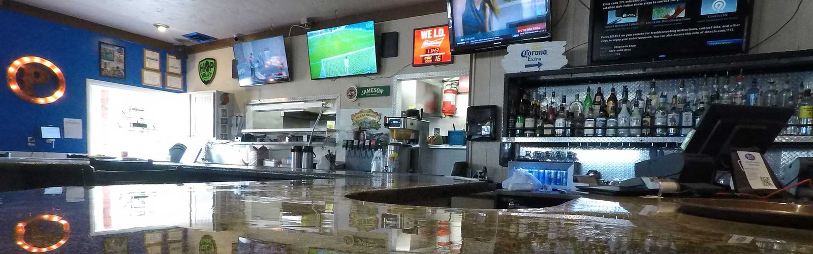 Bar with TVs for watching football at The Lift Bar + Grill in Boise